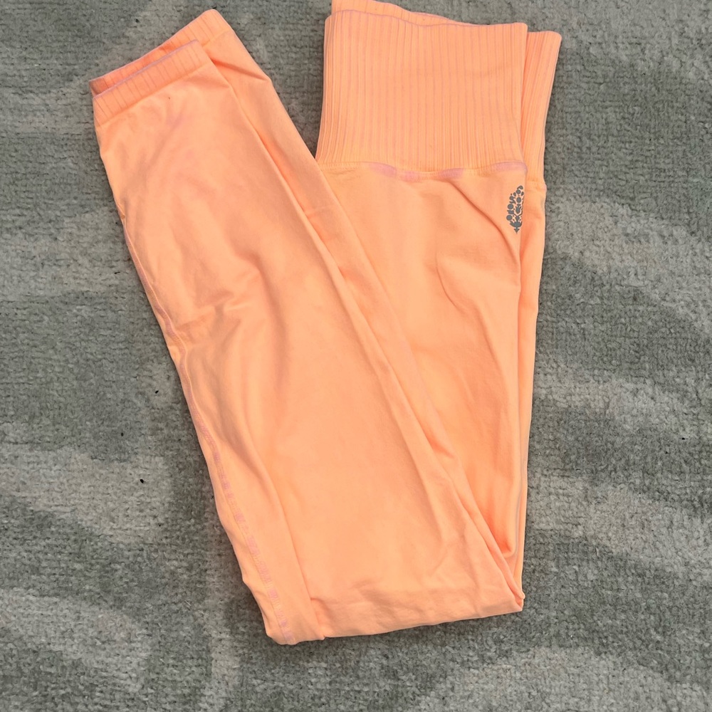 Free people movement orange leggings